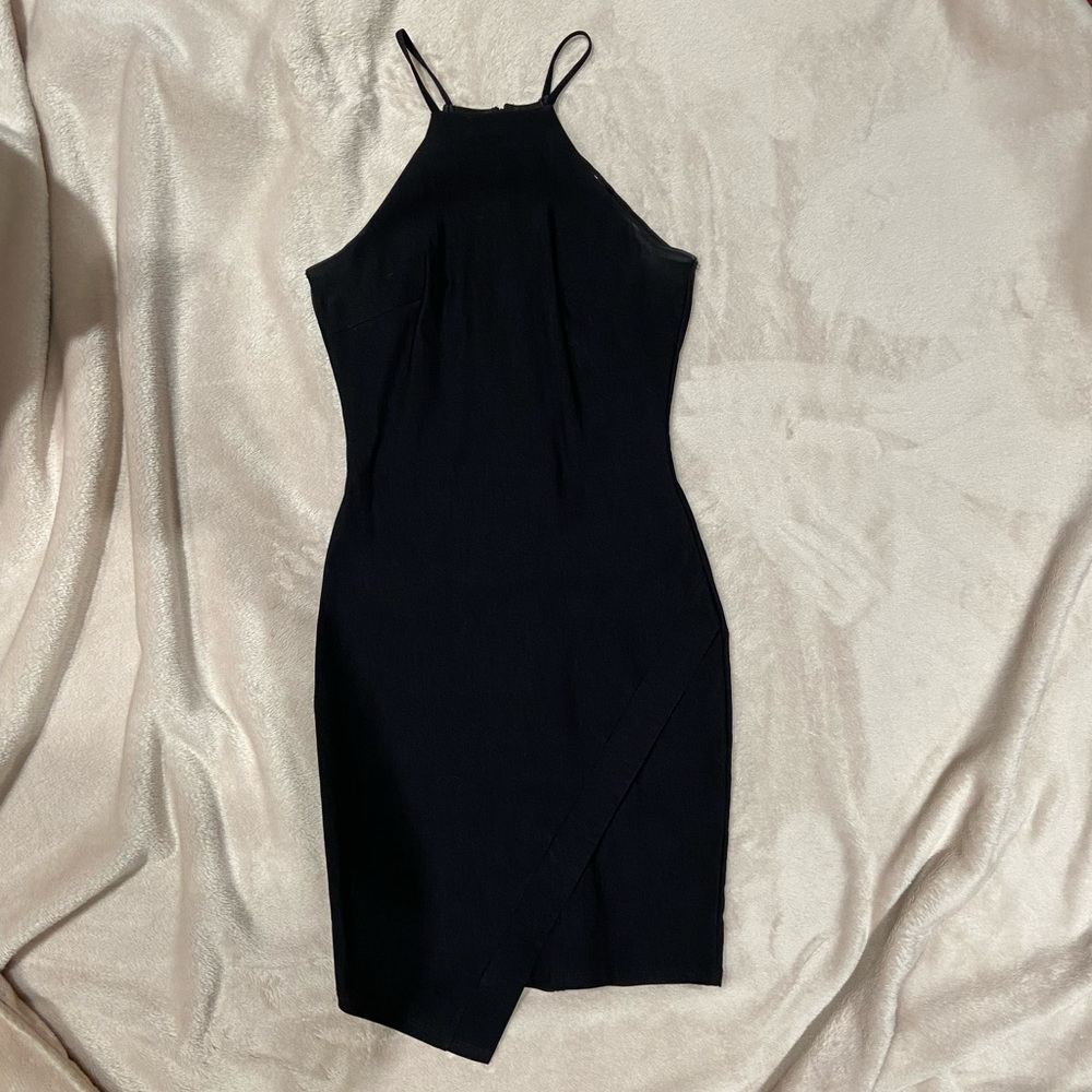 Small fitted black dress asymmetrical hem